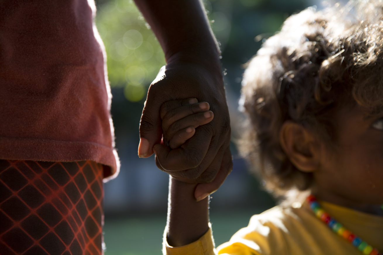 Australia Program 1 Aboriginal mother and child hold hands in the Australia Program 1